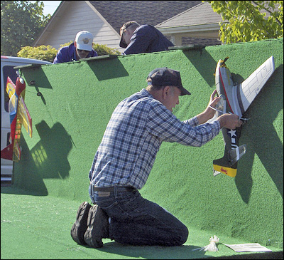 Darcy Niebeling, Bob Beatty, and Bob Treinen Secure the Aircraft